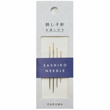 Load image into Gallery viewer, Packaging of Daruma Sashiko Needles, showing 4 gold-colored needles and a threader, against a white and blue background.