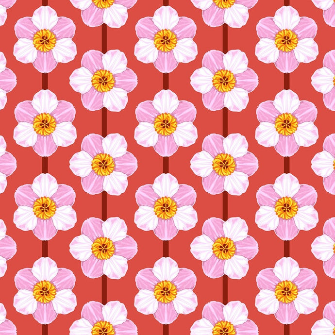 Pattern of pink flowers with yellow centers on a red background