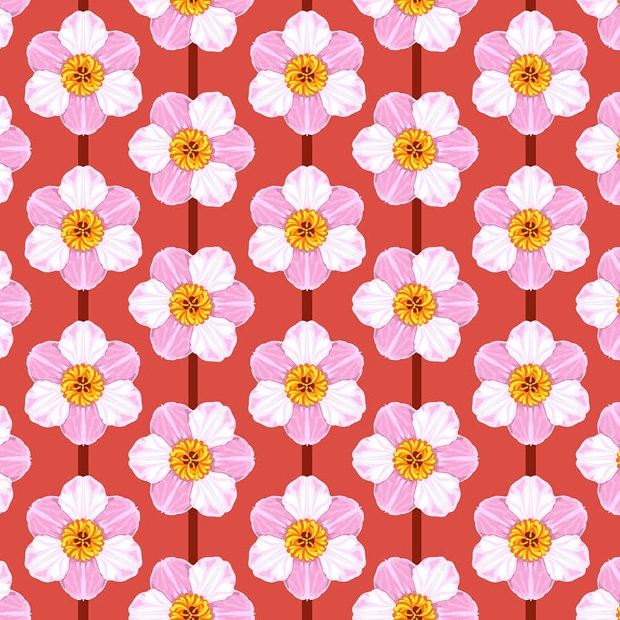 Pattern of pink flowers with yellow centers on a red background